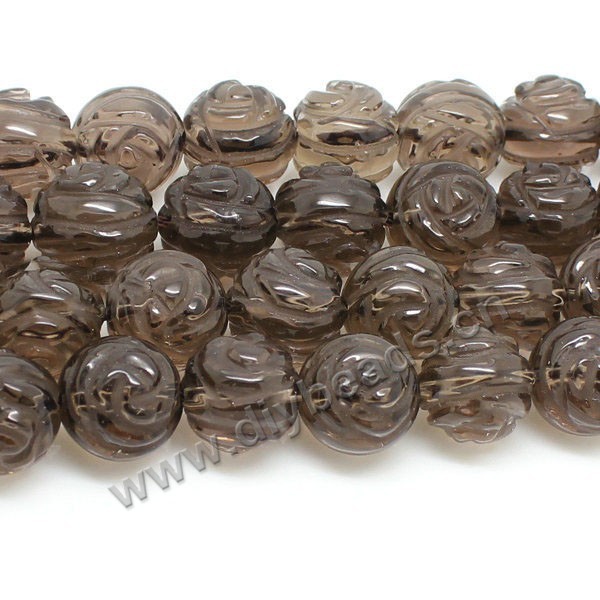 Bead, smoky quartz (heated/irradiated), 12mm carved double side flower. Sold per 16-inch strand