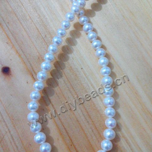 Pearl,cultured freshwater,white,6-7mm nearly round, AAA grade. Sold per pkg of one strand