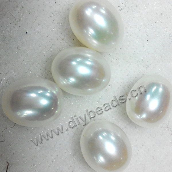 Pearl, cultured fresh water  pearl ,8.5--9mm,white peach mauve, rice shape for earrings no hole. Sold by  pcs