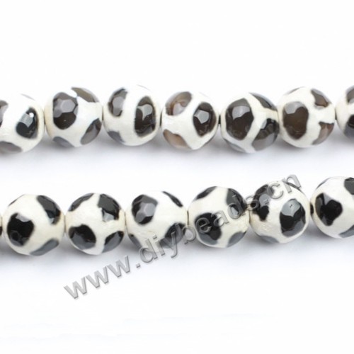 Bead, agate, 12mm faceted round, black with white, football shape. Sold per 15-inch strand.