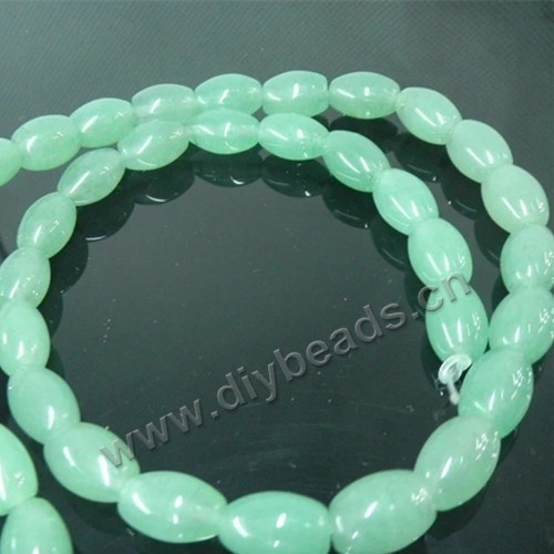 Bead, green aventurine (natural), 7x10mm oval. Sold per 16-inch strand