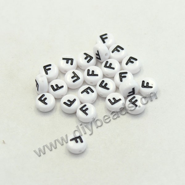 Bead mix, acrylic, white with black alphabet F, 7x4mm double-sided flat round with 1.2mm drill hole. Sold per pkg of 100ps