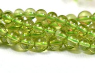 Bead, peridot (natural), 5mm round,A grade Mohs hardness 6-1/2 to 7. Sold per 15-inch strand