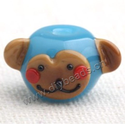 Bead,lampworked glass,blue monkey head, 23*11mm rondelle. Sold per pkg of 5.