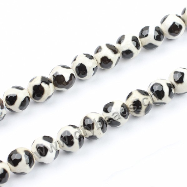 Bead, agate, 10mm faceted round, black with white, football shape. Sold per 15-inch strand.