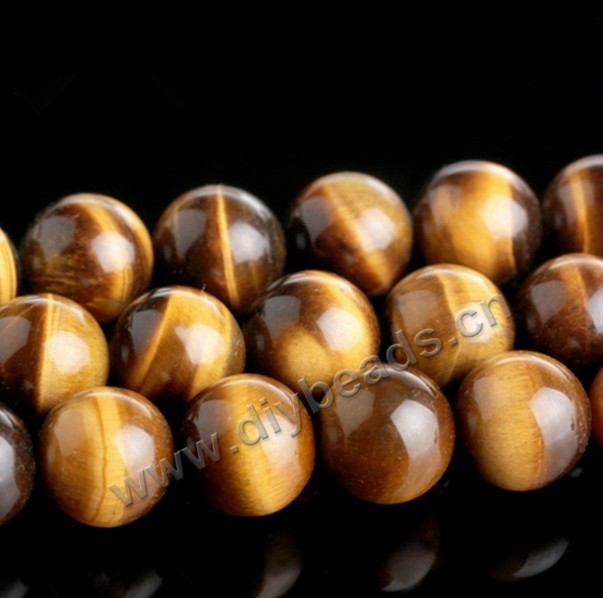 Bead, tigereye (natural), 18mm round. Sold per 16-inch strand
