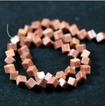 Bead, brown goldstone (manmade), 6mm dice. Sold per 16-inch strand