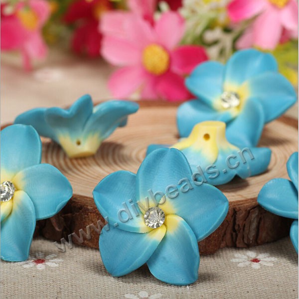 Bead, polymer clay,blue with rhinestone ,30x12mm flower. Sold per pkg of 20.