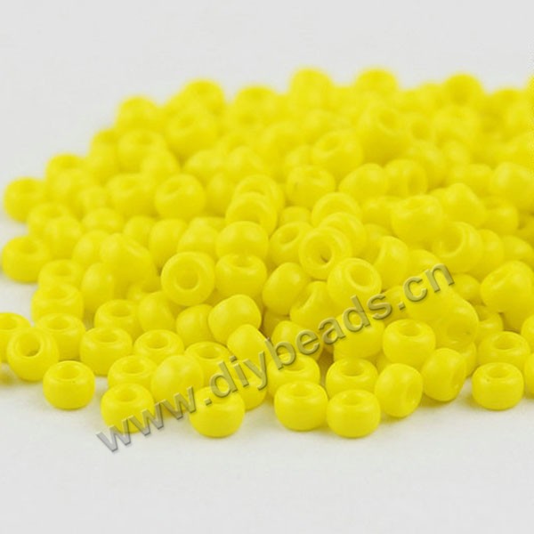 seed bead,glass,opaque yellow,#6 round,sold per pkg of 50g,  approximately 700ps.