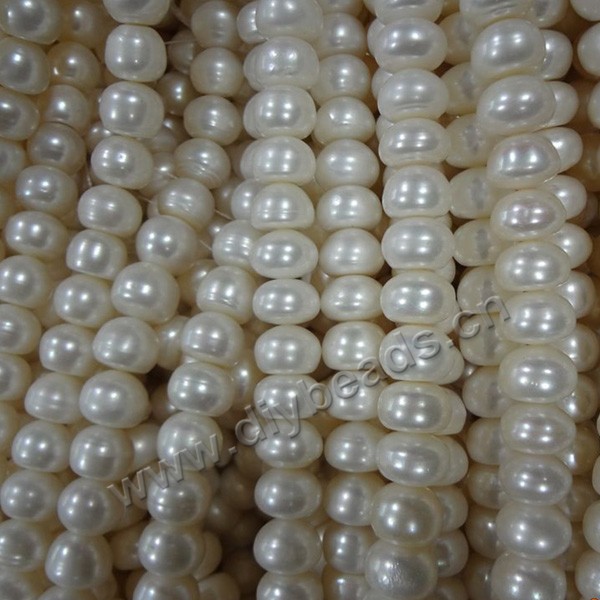 Pearl, cultured freshwater,white ,11-12mm button, A grade. Sold per bag of one strand