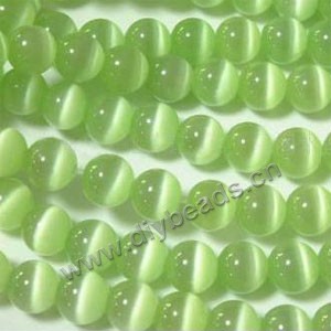 Bead, cat's eye glass,peridot, 12mm round, quality grade. Sold per (10) 14.5-inch strands.