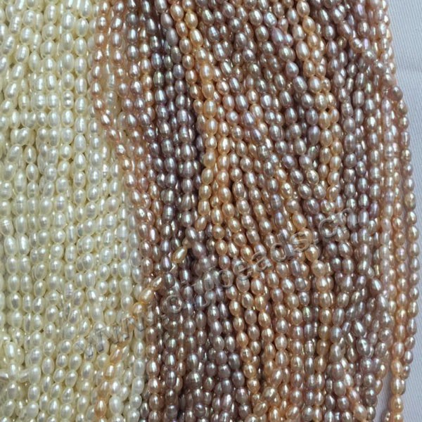 Pearl, cultured freshwater pearl,white pink and purple ,3mm rice, AAA grade. Sold per bag of one strand