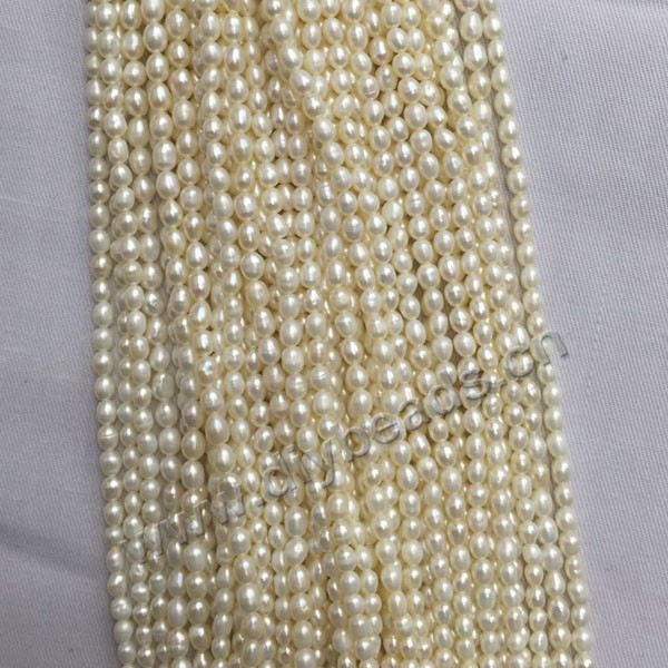 Pearl, cultured freshwater pearl,white ,3mm rice, AA grade. Sold per bag of one strand