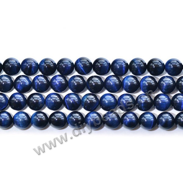 Bead, blue tigereye beads (dyed), 14mm round AA grade. Sold per 16-inch strand