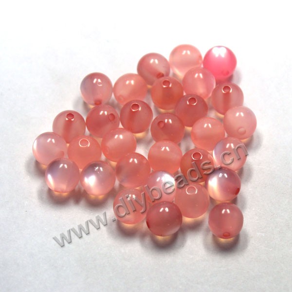 Bead, acrylic, cat's eye pink, 10mm round. Sold per pkg of 100ps