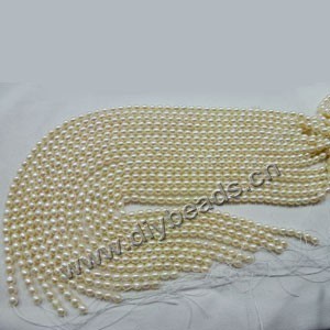 Pearl, cultured freshwater pearl (bleached), white , 5-6mm rice,B+ grade. Sold per pkg of (10) 15-inch strands.