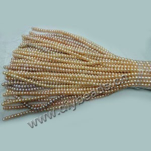 Pearl mix, cultured freshwater pearl ,white / peach / mauve, 9-10mm button,A grade. Sold per pkg of (10) 15-inch strands.