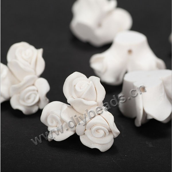 Bead, polymer clay,white,20x12mm flower. Sold per pkg of 5.
