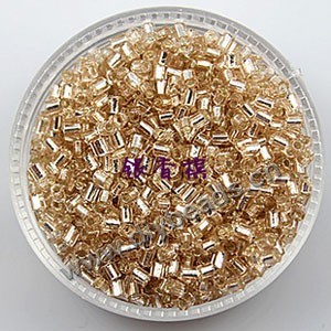 Bugle bead, glass,silver-lined,light brown ,#1(2x2mm) beads. Sold per pkg of 80 grams,approximately 4,500ps.