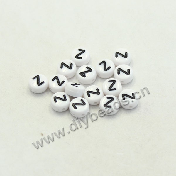 Bead mix, acrylic, white with black alphabet Z, 7x4mm double-sided flat round with 1.2mm drill hole. Sold per pkg of 100ps