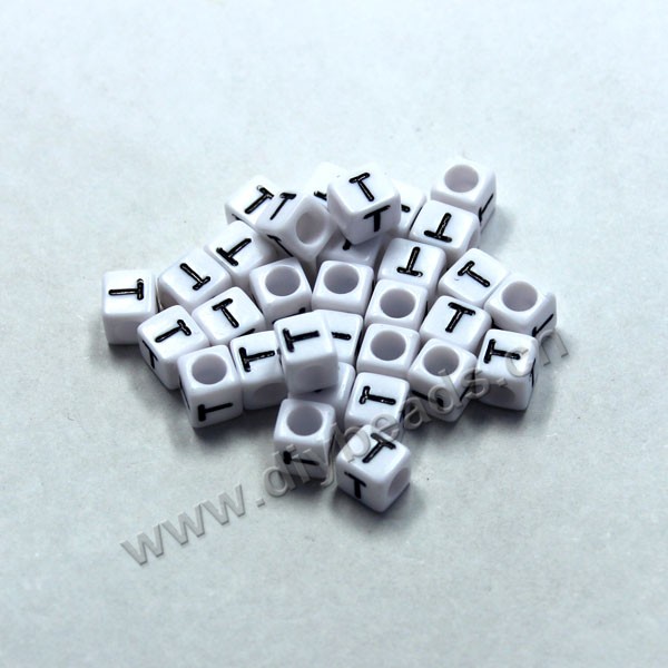 Bead, acrylic,White,alphabet is T, 6x6mm cube with 3.5mm drill hole. Sold per pkg of 100ps