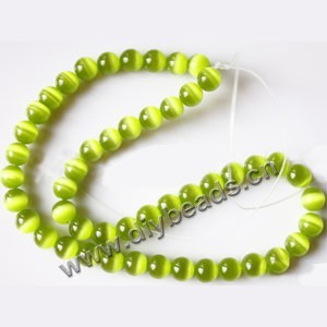 Bead, cat's eye glass,grass green, 8mm round, quality grade. Sold per 14.5-inch strand.