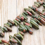Bead, unakite (natural), tusk shape. Sold per 15-inch strand.