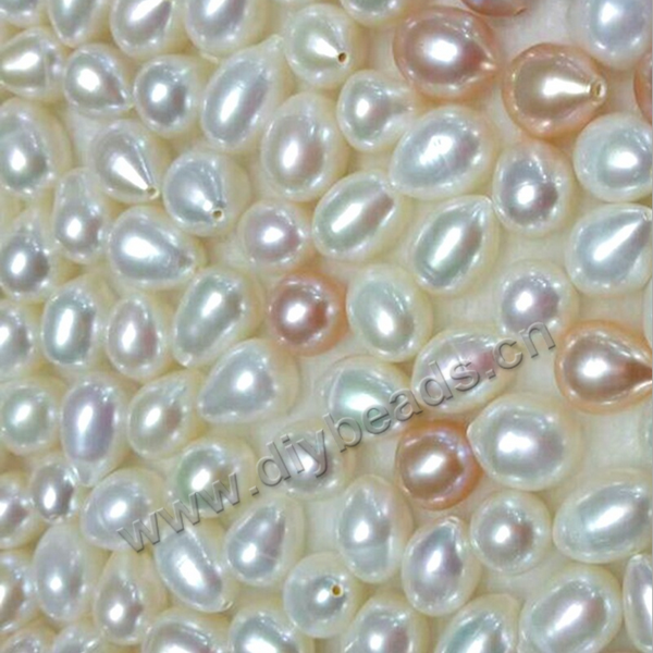   Pearl  rice shape pearl , cultured freshwater,  teardrop pearl with hole   white, 9---10mm. Sold by pcs