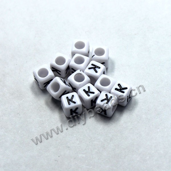 Bead, acrylic,White,alphabet is K, 6x6mm cube with 3.5mm drill hole. Sold per pkg of 100ps
