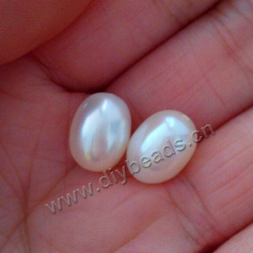 Pearl,cultured freshwater,white,9-10mm rice,half hole, AAAgrade. Sold per pkg of 20pairs