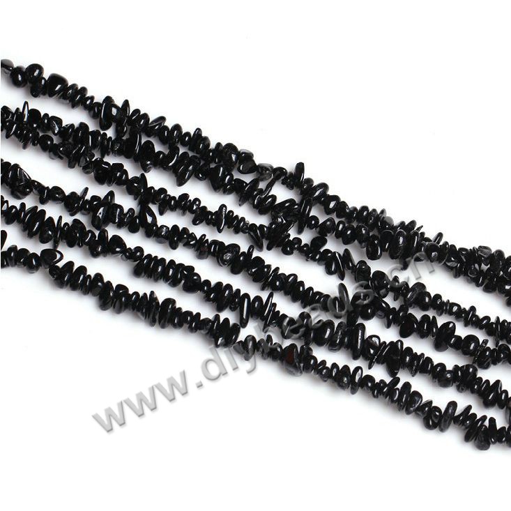 Bead, black tourmaline, 4x7mm chips. Sold per pkg of ten 16-inch strands.