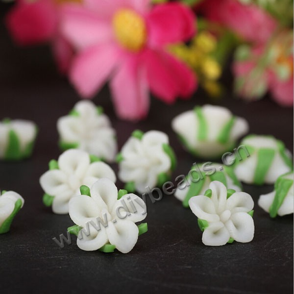 Bead, polymer clay,white with green leaf,12x10mm flower. Sold per pkg of 5.