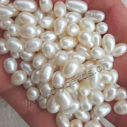 loose Pearl,cultured freshwater,white,7-8mm rice, Agrade. Sold per pkg of one 500g