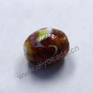 Bead, lampworked glass, brown with flowers, 18x14mm barrel. Sold per pkg of 300.