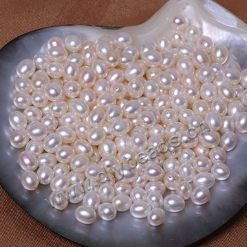 Pearl, cultured freshwater, white/peach/mauve, 7-7.5mm half-drilled rice, AAAA grade. Sold per pkg of 50 pcs.