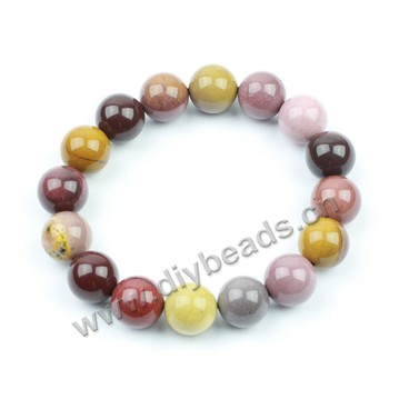 Bracelet, stretch, jasper, multicolor, 10mm faceted round beads, approx 19cm long. Sold per pkg of 5ps.