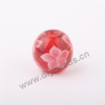 Bead, lampworked glass,red with flower, 14x14mm round.mini order 50pc 