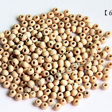 Beads,wood,round loose beads,6mm with 3mm hole. Sold per pkg of 1000ps