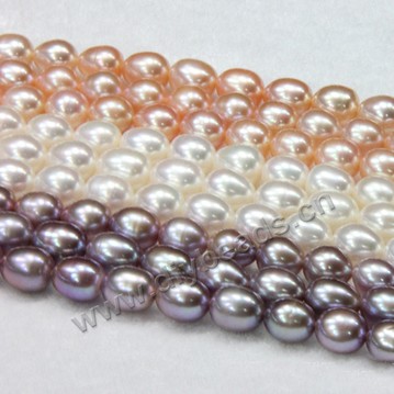 Pearl, cultured freshwater,purple gold white,8-9mm rice, AA grade. Sold per bag of one strand