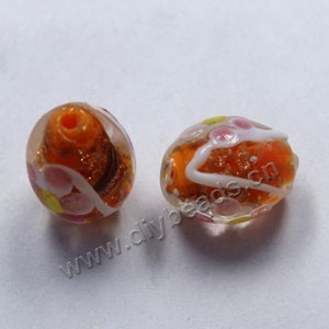 Bead, lampworked glass, orange with flowers, 18x14mm barrel. Sold per pkg of 300.