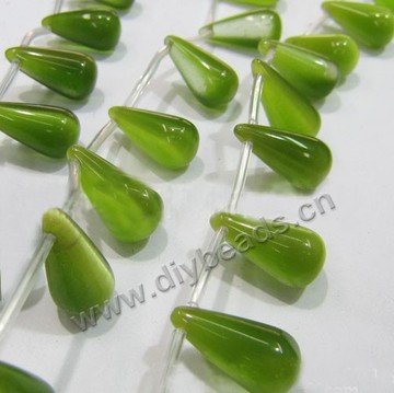 Bead, cat's eye glass,light green, 11x22mm top-drilled teardrop. Sold per 15-inch strand.