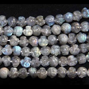 Bead, rainbow moonstone (natural), 12mm skull,A grade, Mohs hardness 6 to 6-1/2. Sold per 16-inch strand