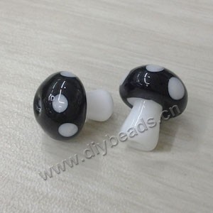 Bead, lampworked glass, black and white, 10x12mm mushroom with spots. Sold per pkg of 20 beads.
