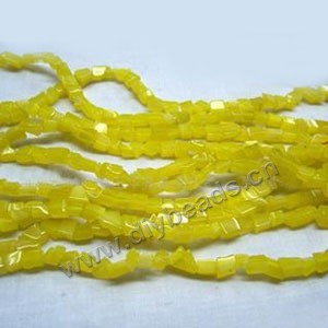 Bead, cat's eye glass, yellow, chip. Sold per 32-inch strand.