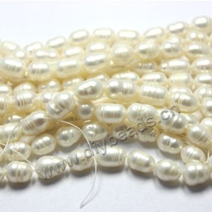 Pearl, cultured freshwater, white, 8-9mm rice , B grade. Sold per pkg of (50) 14-1/2 inch strands.