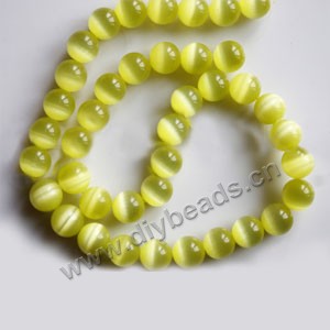 Bead, cat's eye glass,yellow, 10mm round, quality grade. Sold  (10) 14.5-inch strands.