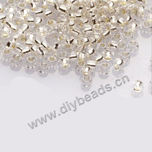 #11 seed beads,glass,ivory,silver-lined,irregular round.sold per pkg of 1/2 kilo.