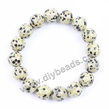 Bracelet, stretch, dalmatian jasper, mix colors, 10mm round beads. Sold per pkg of 10ps 