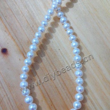 Pearl,cultured freshwater,white,6-7mm nearly round, AAA grade. Sold per pkg of one strand