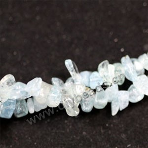 Bead, blue aquamarine (natural), 10mm chip. Sold per 35-inch strand